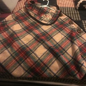 ponchowith the initials SGA in a size medium